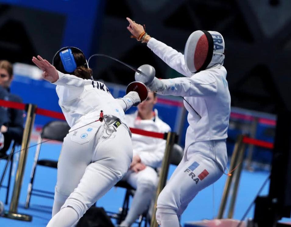 Competitive fencer in competition