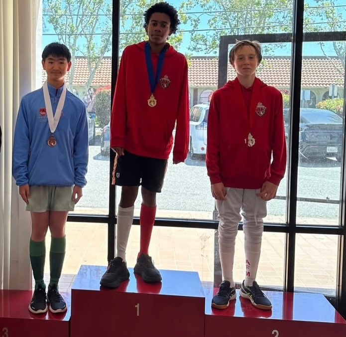 Sequoia Fencing Academy athlete on the podium at a fencing tournament