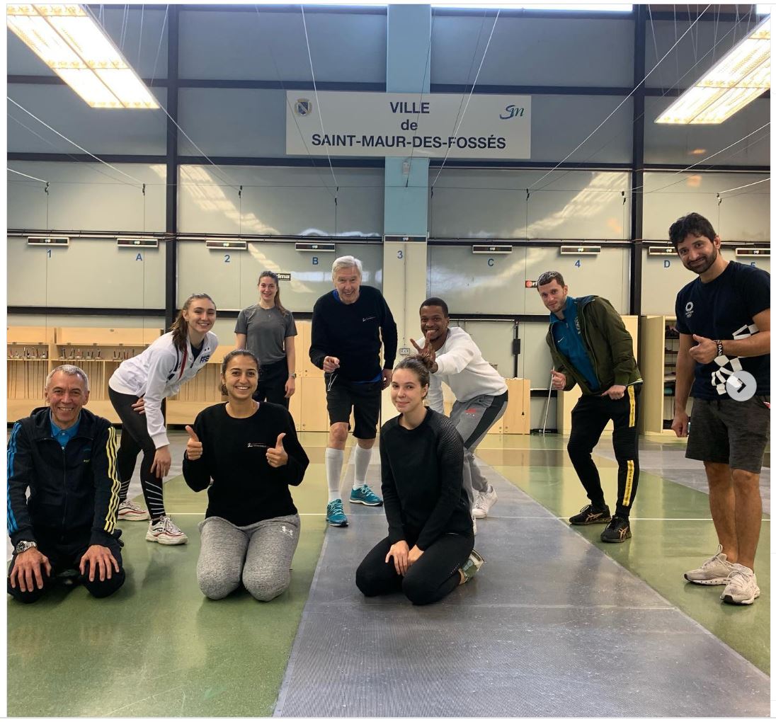 Coach Yuriy Mazur in action: team photo with successful athletes